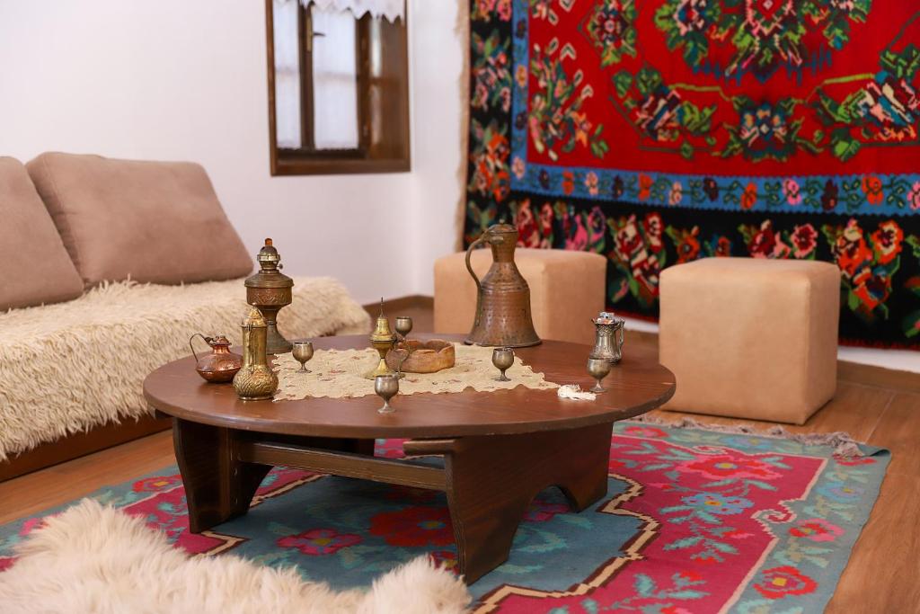 a living room with a coffee table and a couch at Hotel Borklad in Berat