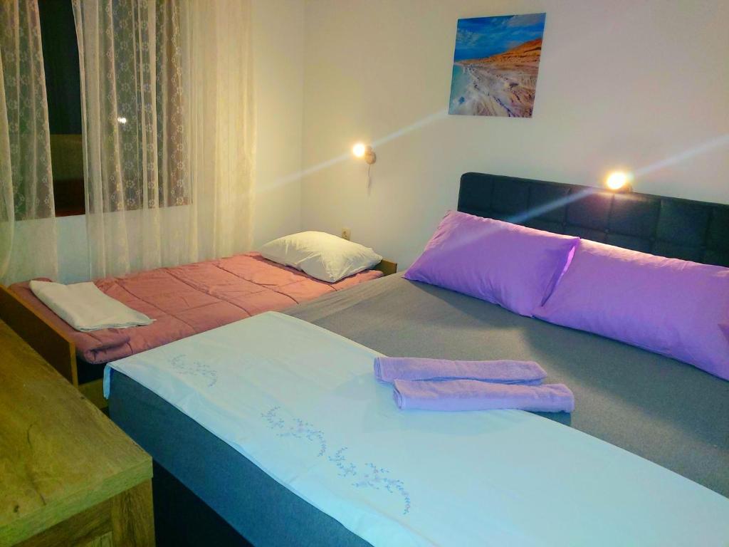 Postel nebo postele na pokoji v ubytování Apartman Arija-Pino