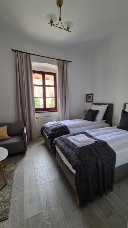 Postel nebo postele na pokoji v ubytování SUKIENNICE MIĘDZYLESIE