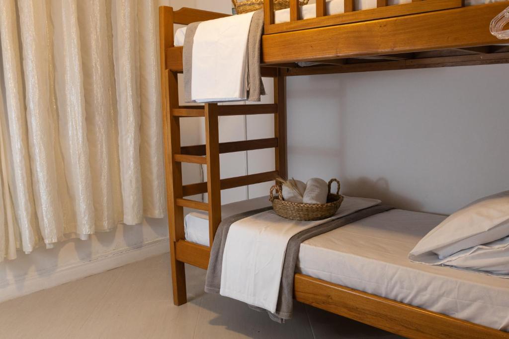 Krevet ili kreveti na kat u jedinici u objektu Casa azul Ilha Grande
