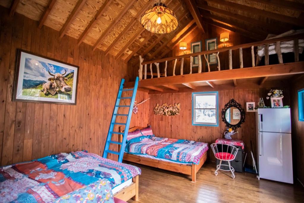 Postel nebo postele na pokoji v ubytování First Class Backpackers Inn - FBI AWAJI