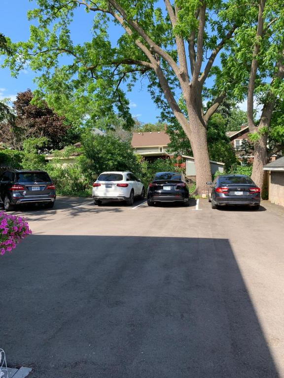 a group of cars parked in a parking lot at Ambiance By The Falls B&B in Niagara Falls