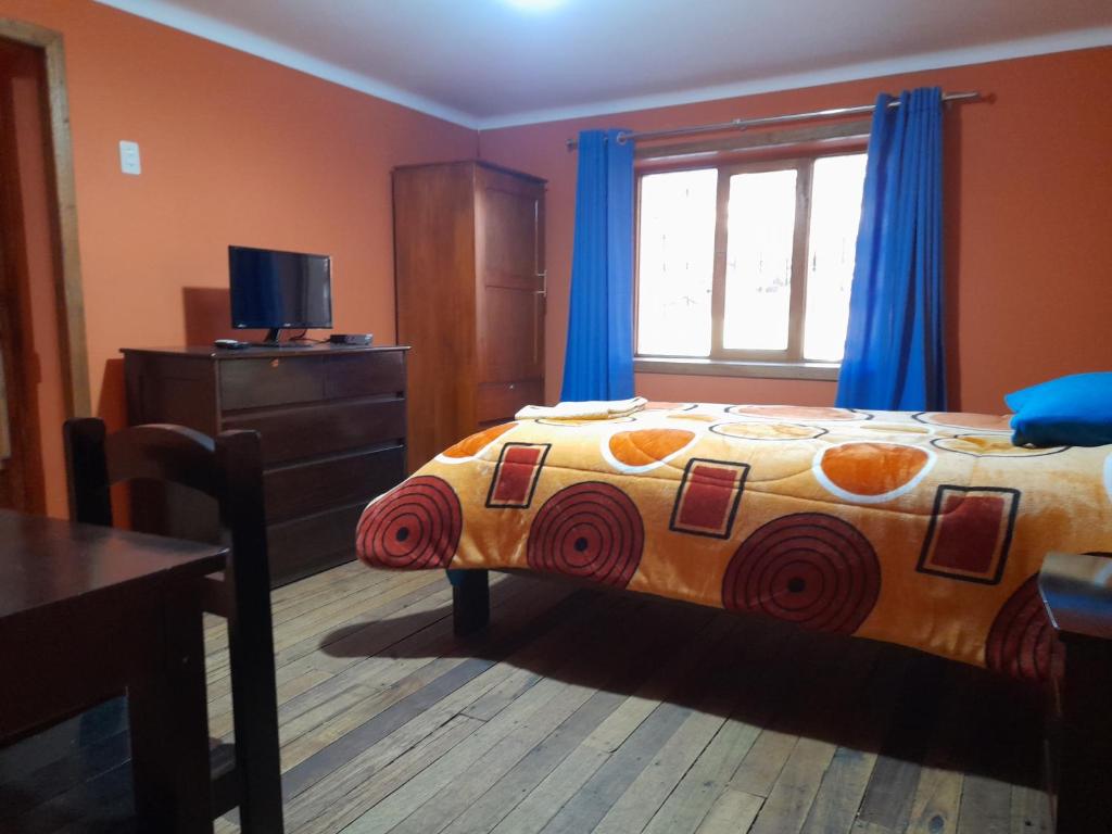 Postel nebo postele na pokoji v ubytování Hospedaje Encanto de Chinchero