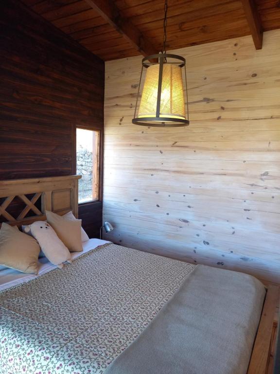 A bed or beds in a room at Cabaña de Campo - Valle de Calamuchita - Sierras de Córdoba