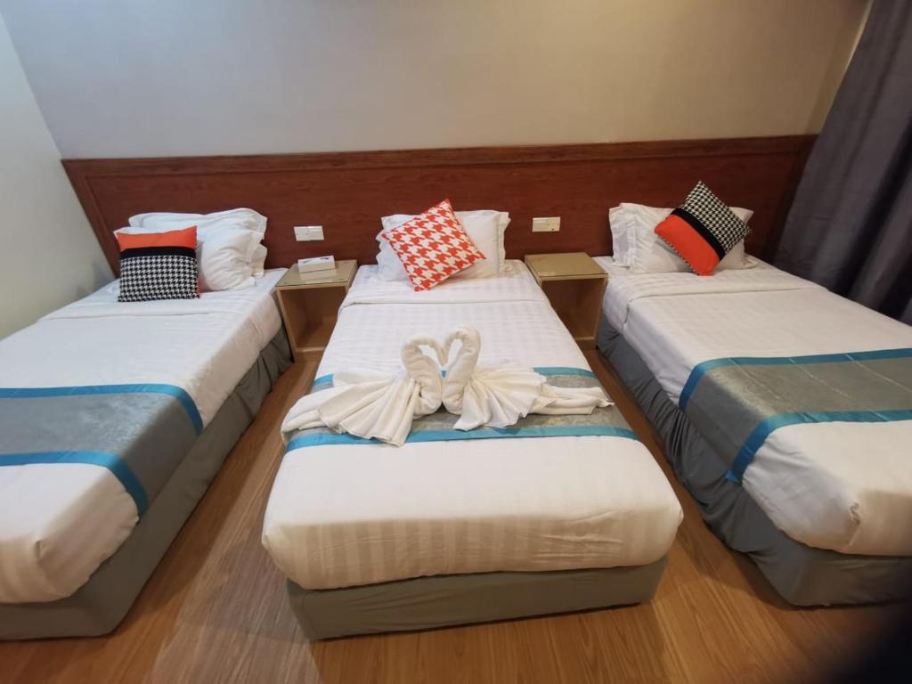 Postel nebo postele na pokoji v ubytování TD CAPITAL HOTEL