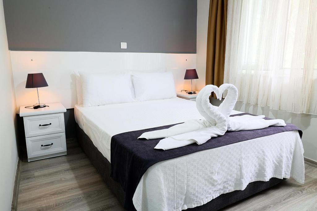 Кровать или кровати в номере Canada Hotel & Bungalows