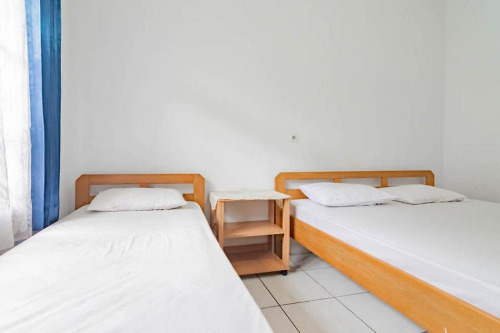 Pall Inn Puncak Mitra RedDoorz - Family Room