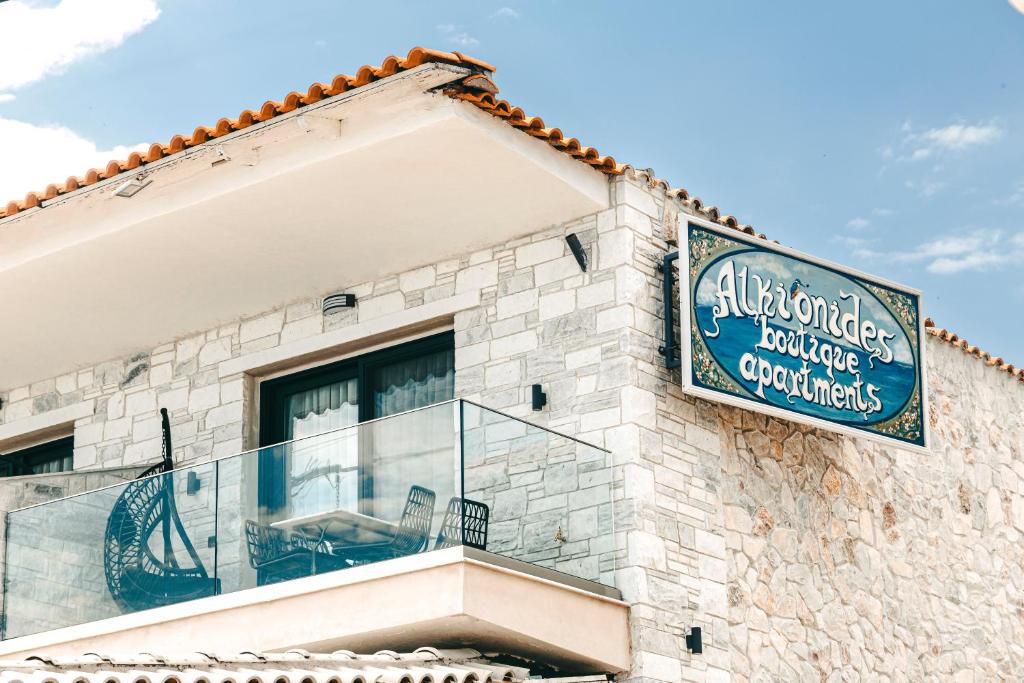 a sign on the side of a building at Alkionides Apartments in Polykhrono