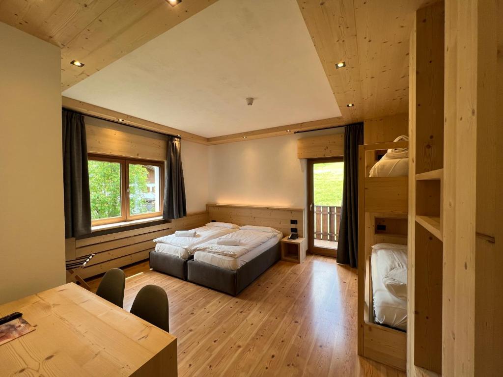Postel nebo postele na pokoji v ubytování Hotel D'La Varda