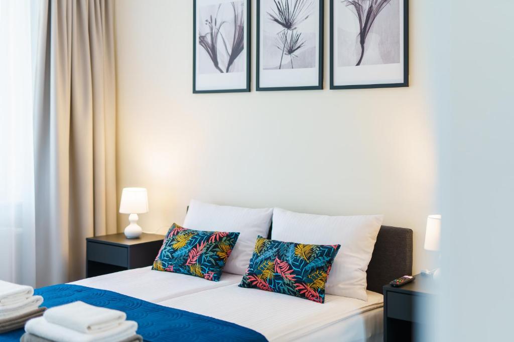 Postel nebo postele na pokoji v ubytování Apartamenty Adyl Platany