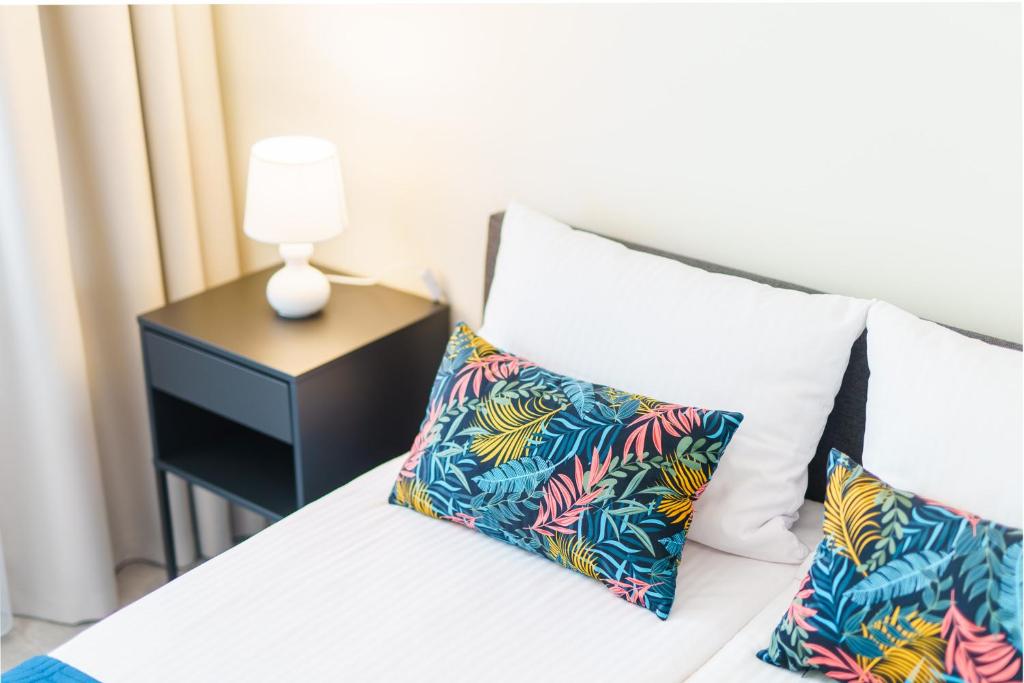 Postel nebo postele na pokoji v ubytování Apartamenty Adyl Platany