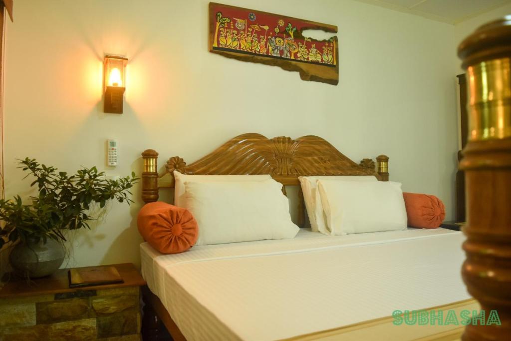 Postel nebo postele na pokoji v ubytování Subhasha Summer House