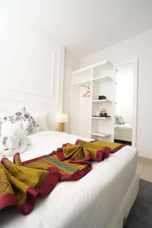 Postel nebo postele na pokoji v ubytování Alam Hotel by Cordela