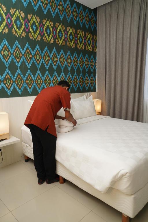 Postel nebo postele na pokoji v ubytování Alam Hotel by Cordela