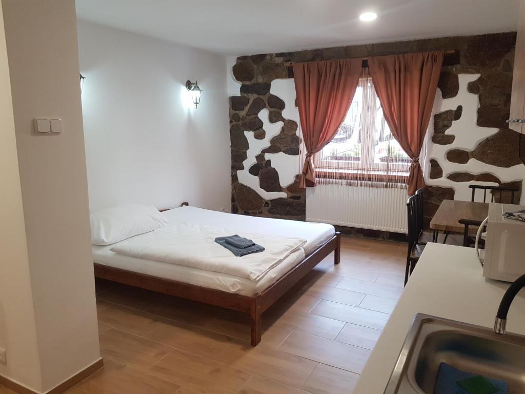 Postel nebo postele na pokoji v ubytování Penzion na statku Březová