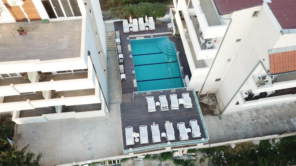 an overhead view of a swimming pool in a building at Etna Apartments in Ulcinj