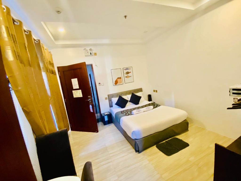Postel nebo postele na pokoji v ubytování Mirage Suites de Boracay
