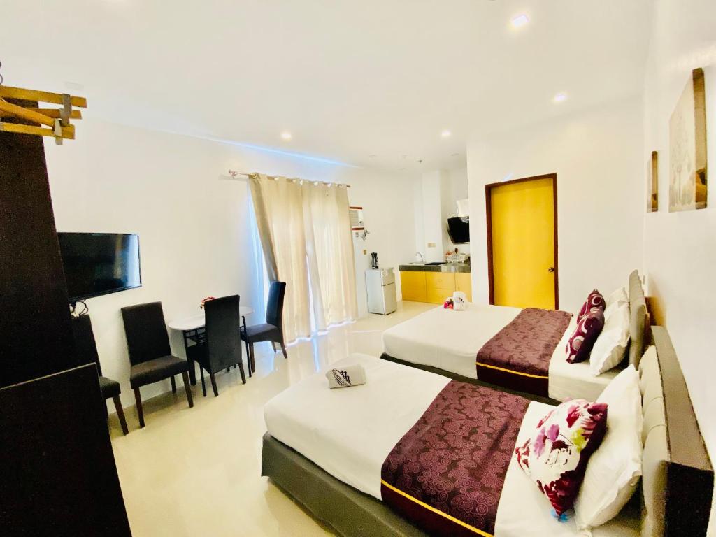 Postel nebo postele na pokoji v ubytování Mirage Suites de Boracay