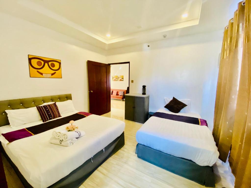 Postel nebo postele na pokoji v ubytování Mirage Suites de Boracay