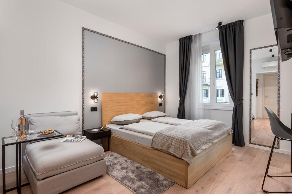Posteľ alebo postele v izbe v ubytovaní Deluxe Apartments ''In the Center''