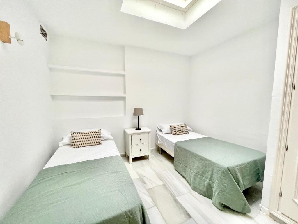 Posteľ alebo postele v izbe v ubytovaní Golden Beach La Palma - EaW Homes