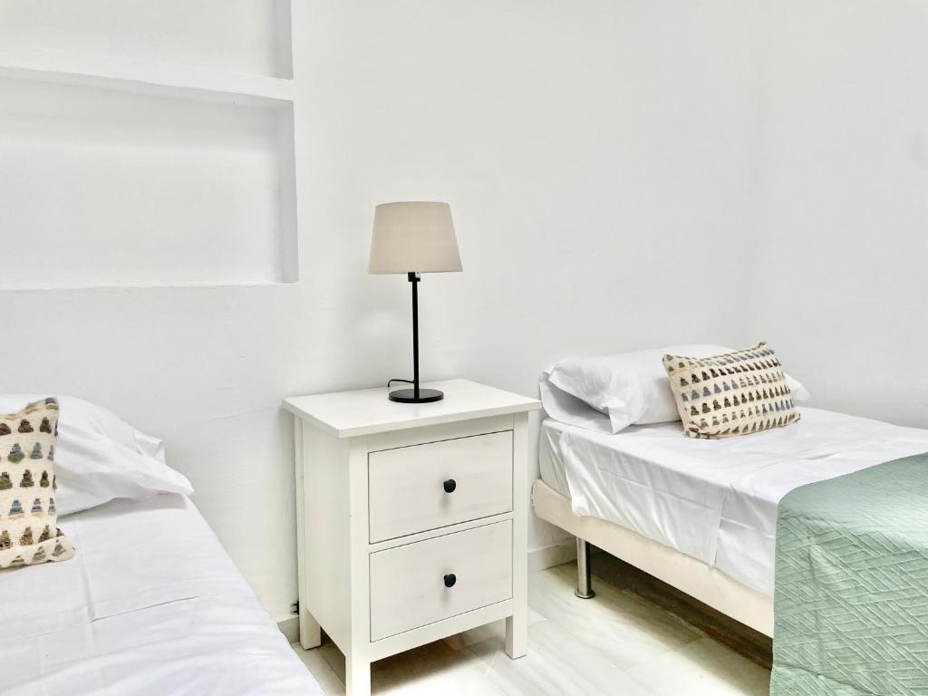 Posteľ alebo postele v izbe v ubytovaní Golden Beach La Palma - EaW Homes