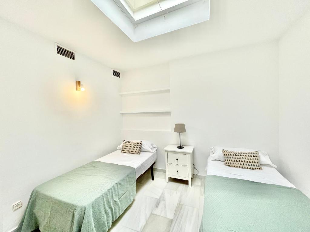 Posteľ alebo postele v izbe v ubytovaní Golden Beach La Palma - EaW Homes