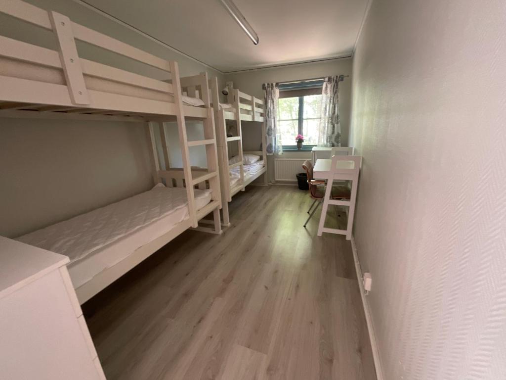 Postel nebo postele na pokoji v ubytování Aspan Kurs & Lägergård