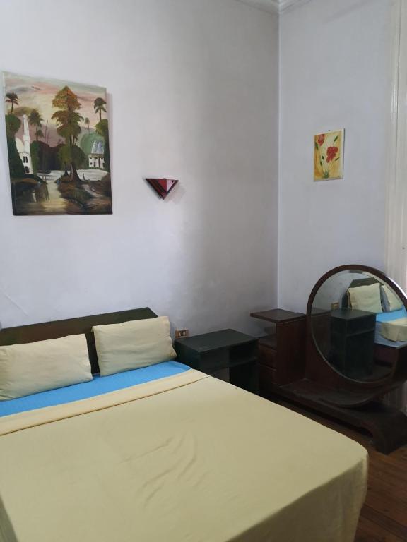 Postel nebo postele na pokoji v ubytování African House Hostel