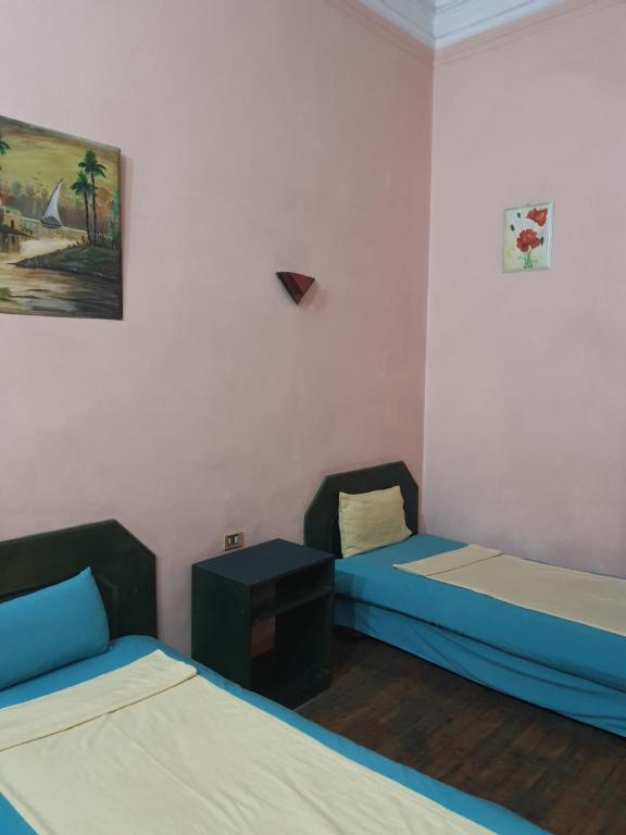 Postel nebo postele na pokoji v ubytování African House Hostel