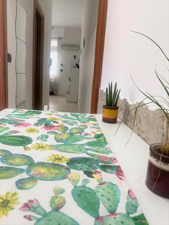 Łóżko lub łóżka w pokoju w obiekcie La casa di Andrea