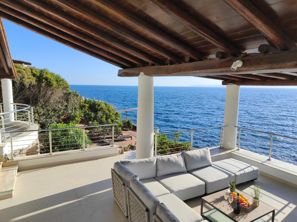 a view of the ocean from the balcony of a house at Villa Bella in Torre delle Stelle