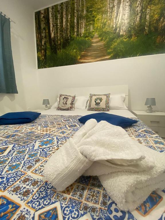 Łóżko lub łóżka w pokoju w obiekcie La casa di Andrea