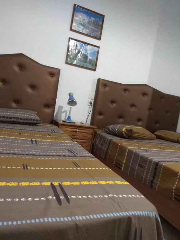 Postel nebo postele na pokoji v ubytování Villa Elli