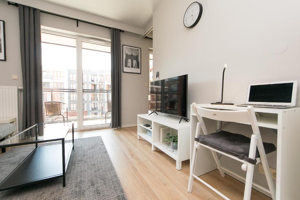 Televízia a/alebo spoločenská miestnosť v ubytovaní Main Trainstation one bedroom AC p4you pl