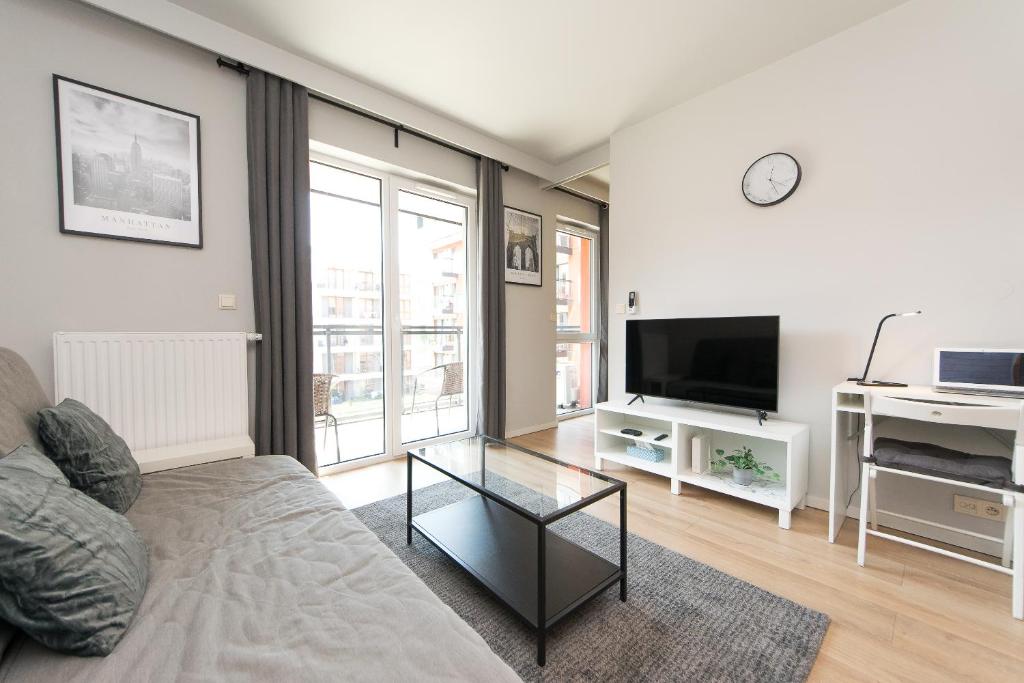 Televízia a/alebo spoločenská miestnosť v ubytovaní Main Trainstation one bedroom AC p4you pl