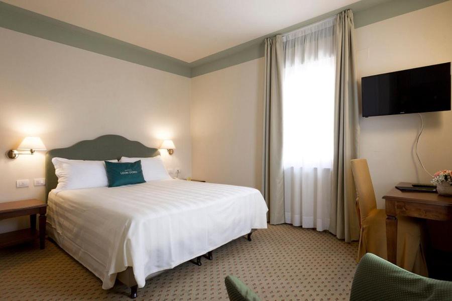Posteľ alebo postele v izbe v ubytovaní Cora Hotels Leon d'Oro
