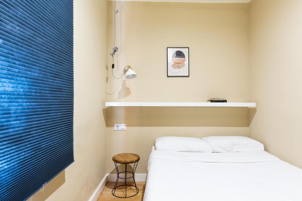 Posteľ alebo postele v izbe v ubytovaní WOW Apartments by Olala Homes