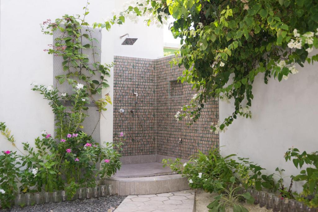 Zahrada ubytování Palm Gate Maldives