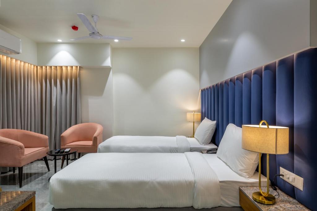 Postel nebo postele na pokoji v ubytování Hotel Nalanda