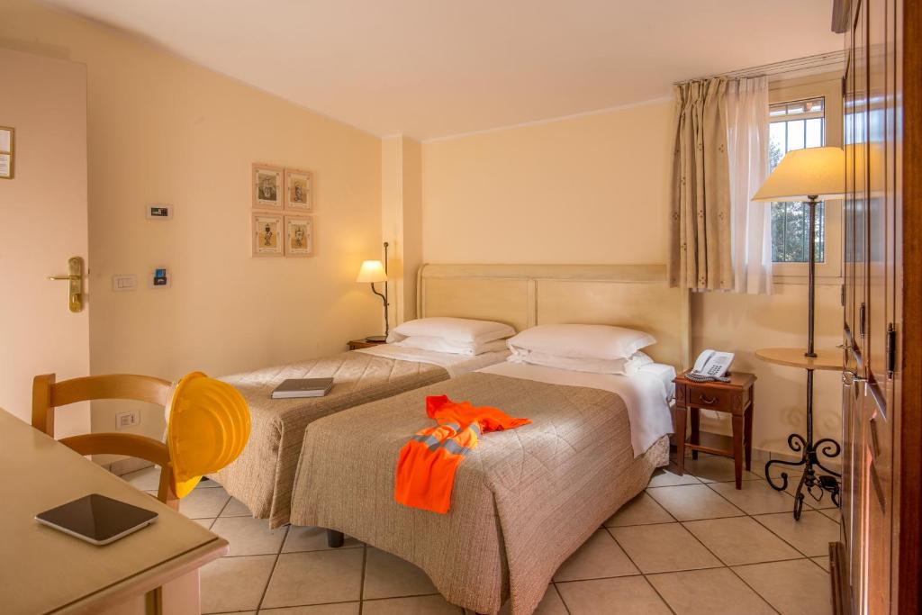 Postel nebo postele na pokoji v ubytování Hotel Selva Candida