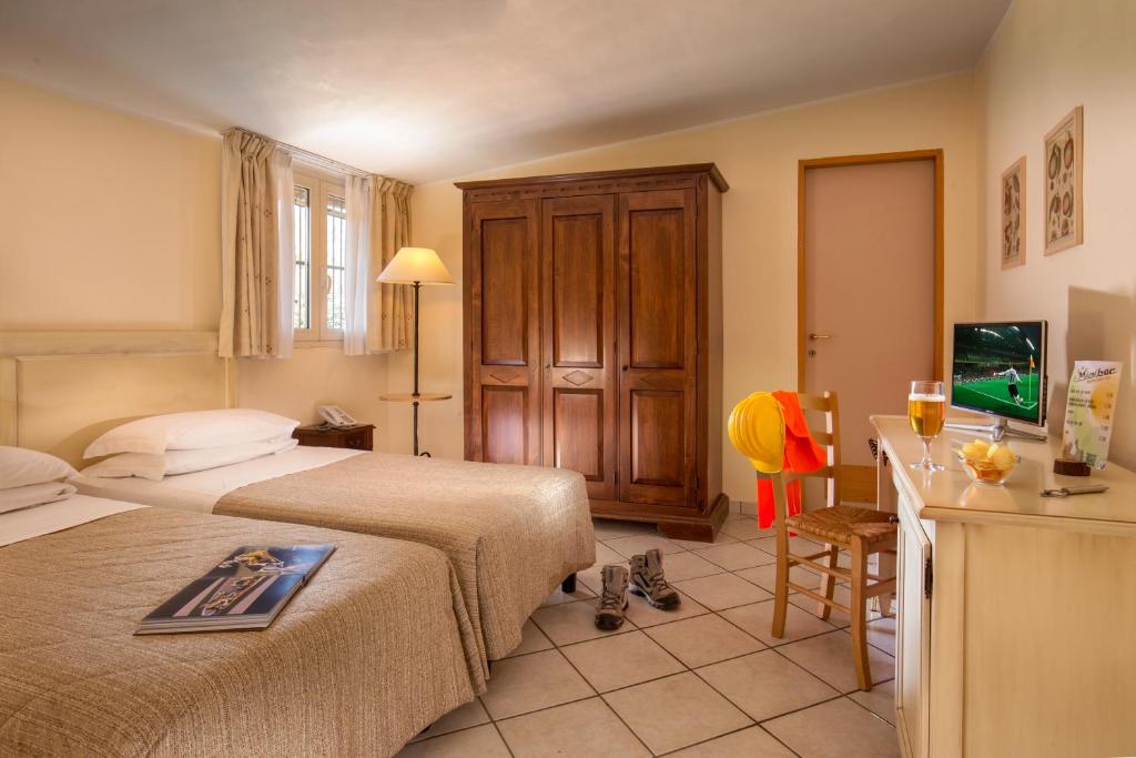 Postel nebo postele na pokoji v ubytování Hotel Selva Candida