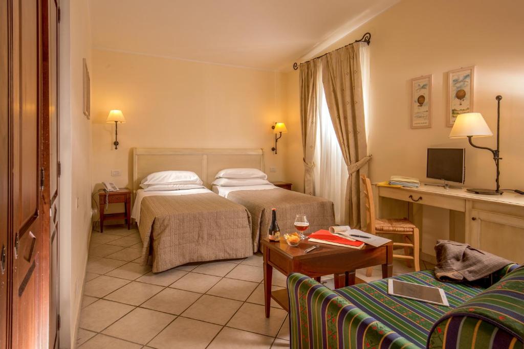 Postel nebo postele na pokoji v ubytování Hotel Selva Candida