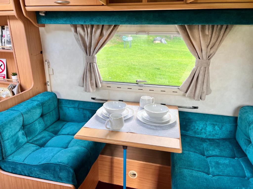 Posezení v ubytování Apusenia Caravan Escape Padiș - Glăvoi