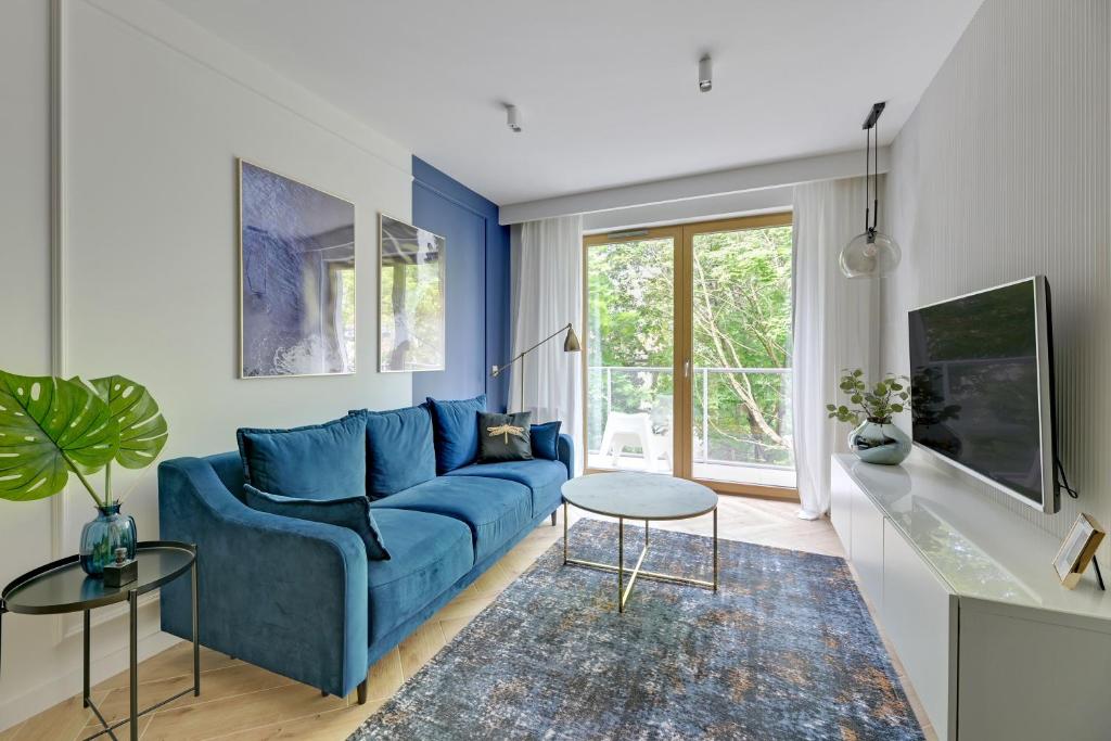 Televízia a/alebo spoločenská miestnosť v ubytovaní Comfort Apartments Dolny Sopot