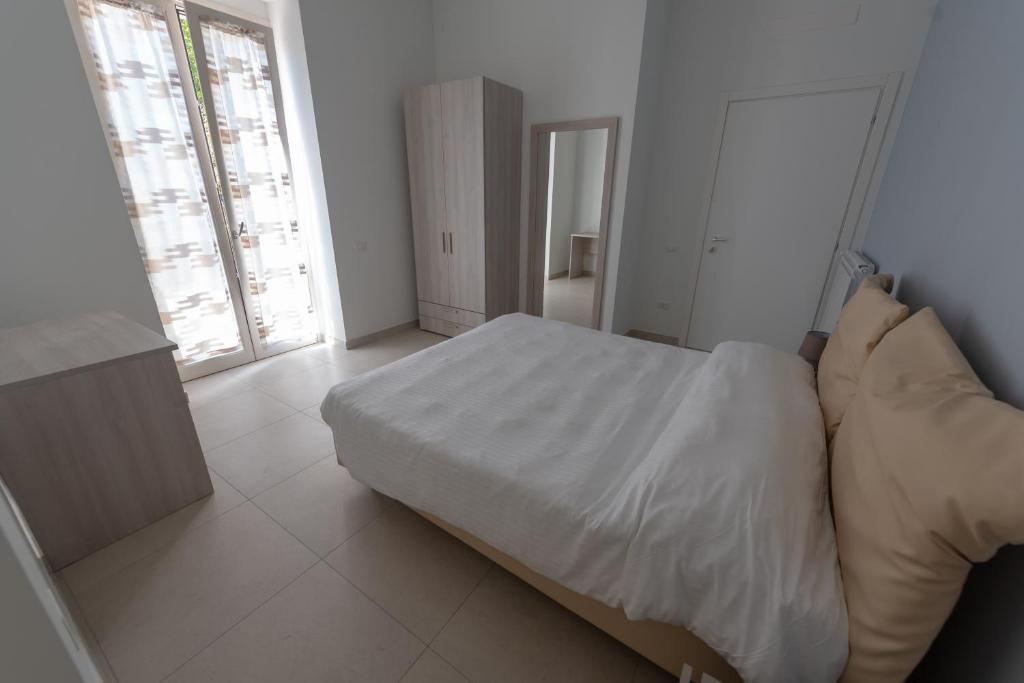 Łóżko lub łóżka w pokoju w obiekcie Villa Maria Cristina d'Amico