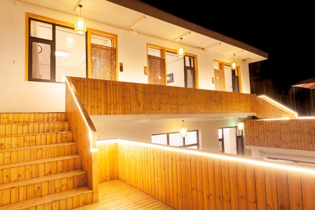 a staircase in a building with lights on it at ManBuYunDuan.Theme Inn in Wutai