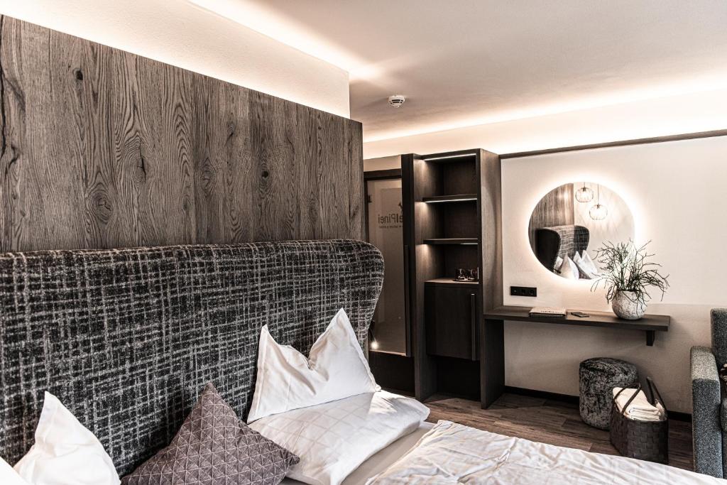 Postel nebo postele na pokoji v ubytování Hotel Pinei