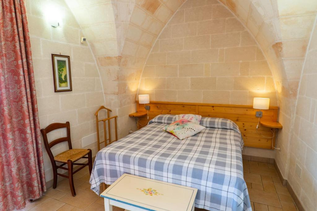 Postel nebo postele na pokoji v ubytování Relais La Giara