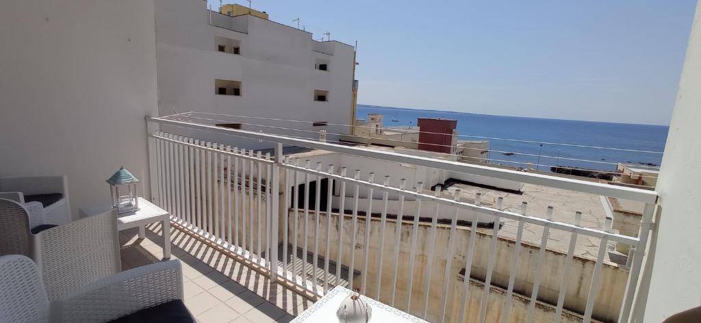 a balcony with a view of the ocean at B&B Centrale in Gallipoli
